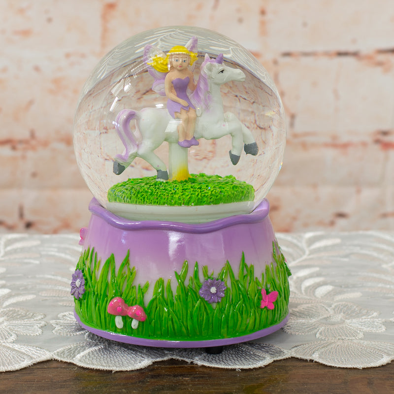 Front view of Purple Fairy and Unicorn Rotating Figurine Snow Globe