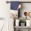 Double oven mitt hanging in kitchen